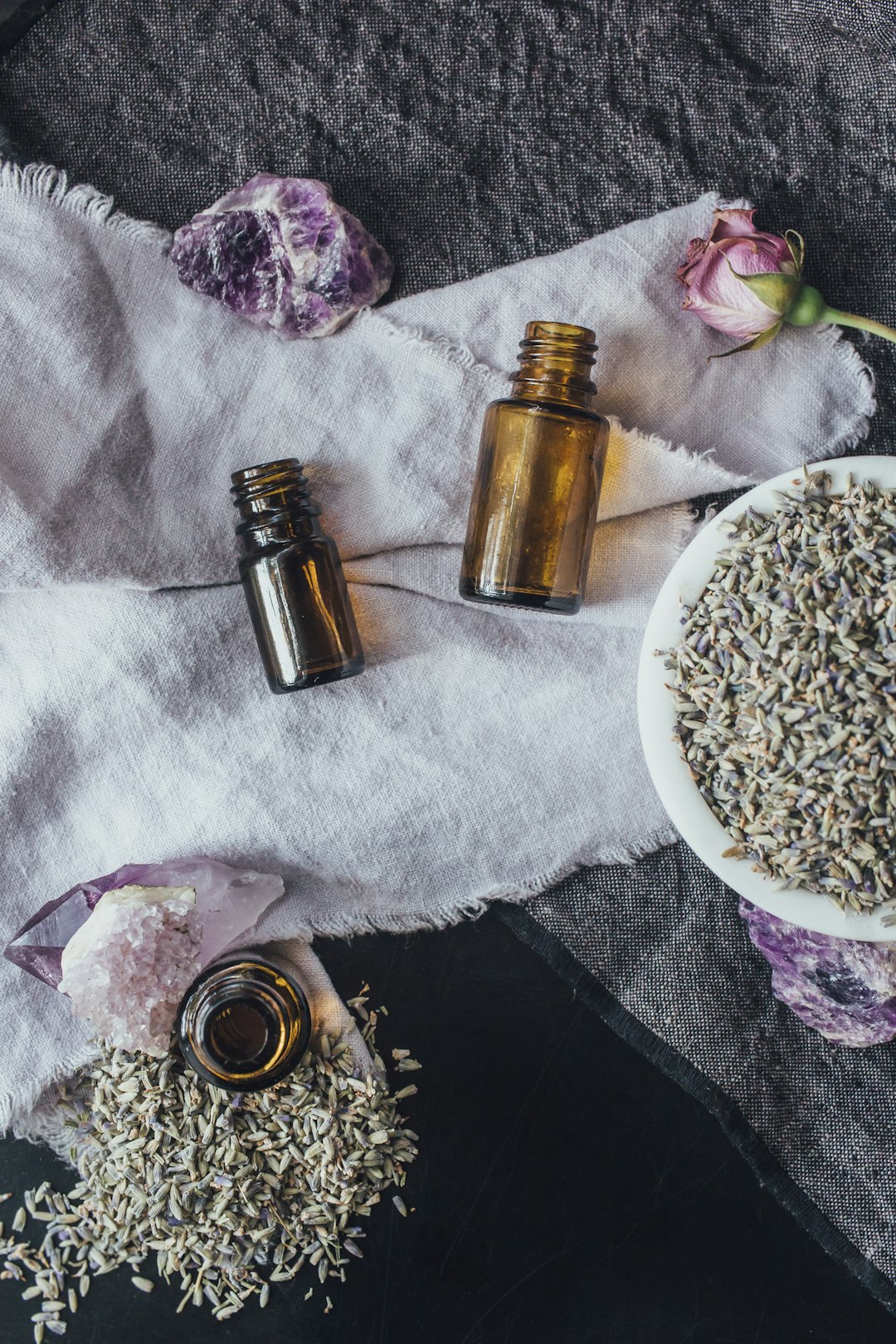 Essential oil bottles with lavender and amethyst.